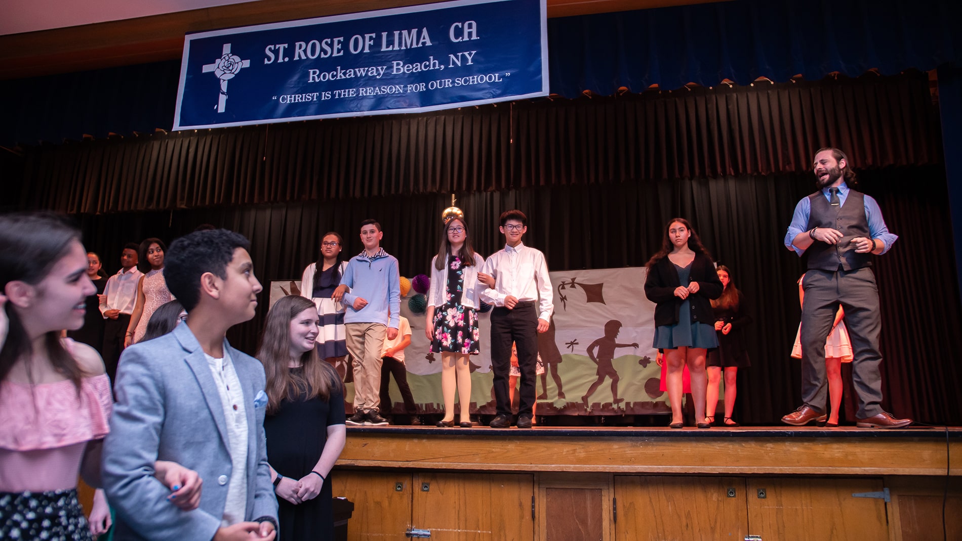 Students at St. Rose of Lima Spring Concert with their Ballroom Basix instructor.