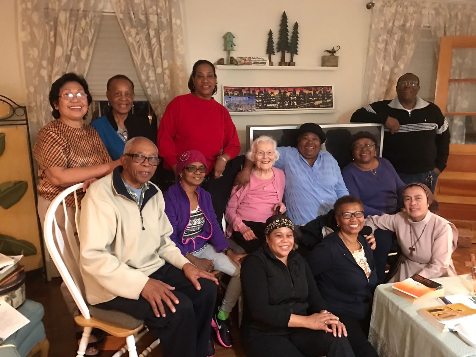 Sister Vilma joins the home-based group at the home of group leader Teresa Tobias.