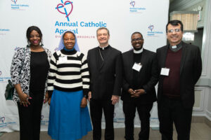 Bishop Brennan with donors and clergy
